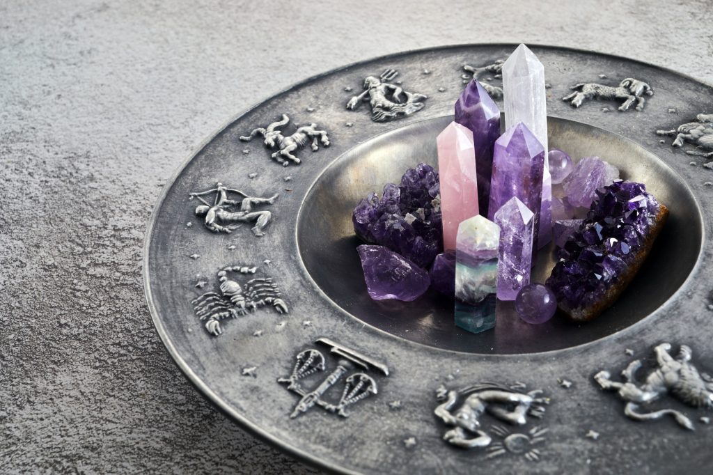 Crystals for healing, fortune telling and astrologhy circle on grey background. Esoteric and life